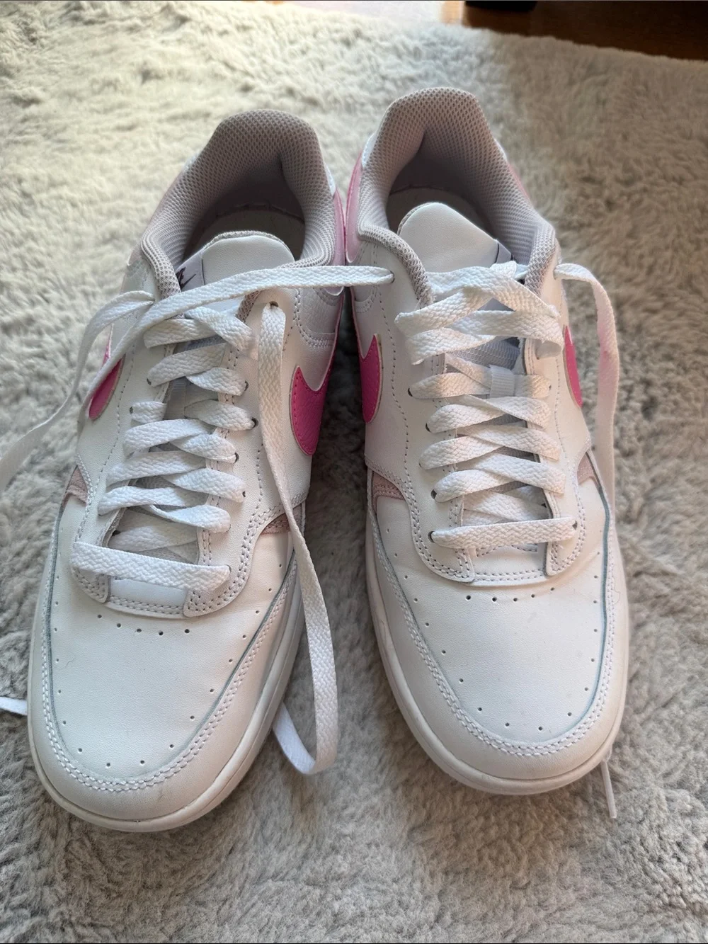 Nike Women's White Sneakers with Pink Swoosh